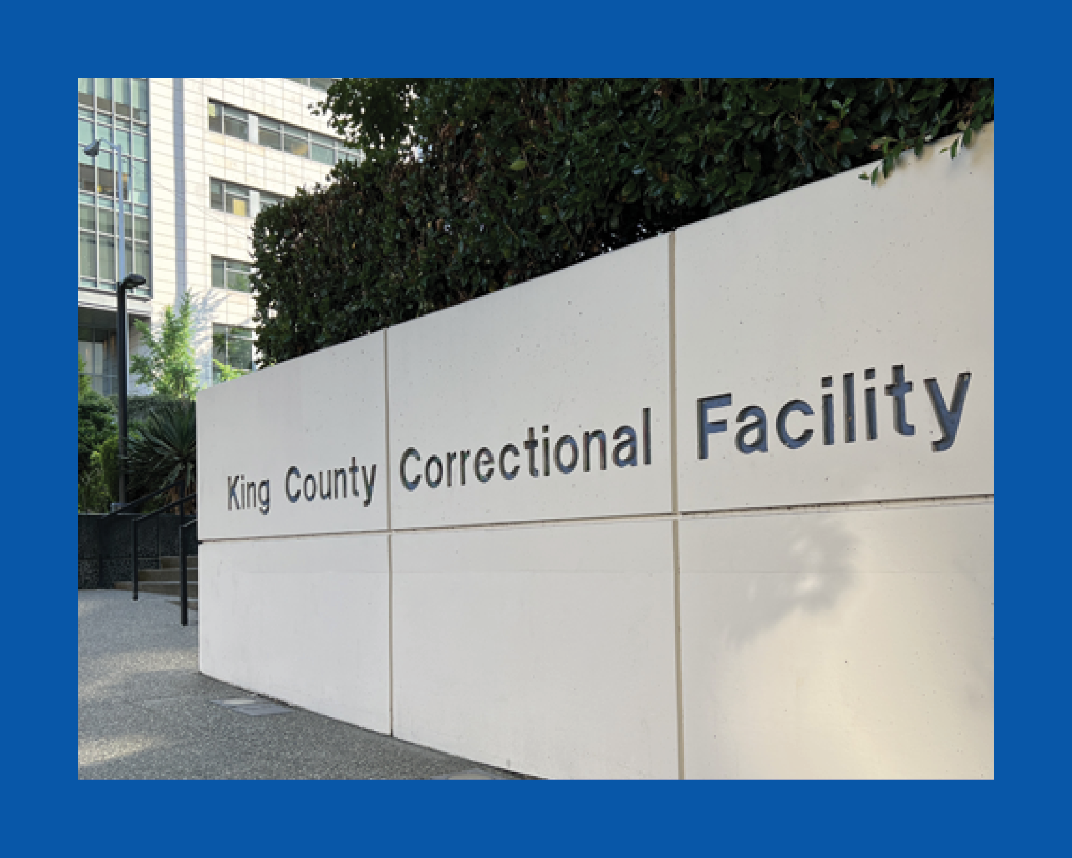 A photo of the sign outside of the King County Correctional Facility