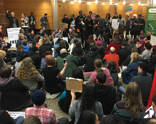 Photo of protestors at Sea-Tac Airport