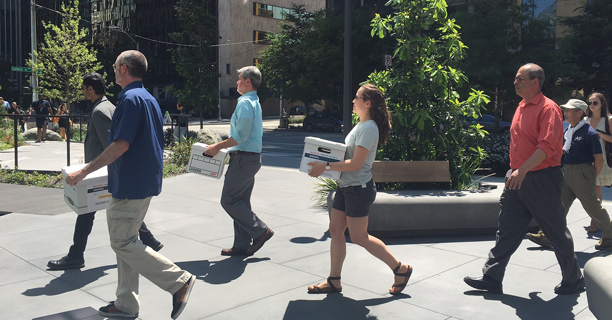 Photo of coalition partners delivering over 150,000 signatures to Amazon asking them not to sell face surveillance systems to the government