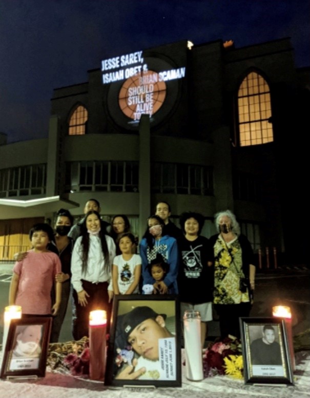 A photo of Jesse's loved ones at the Projecting Justice vigil