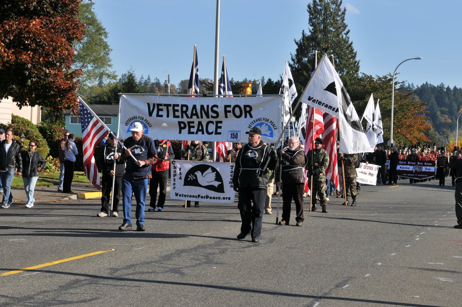 Photo of veterans for peace marching linking to an article about Veterans For Peace Sues to March in Veterans Day Parade 