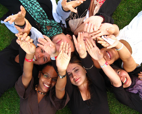 Photo of people with raised hands