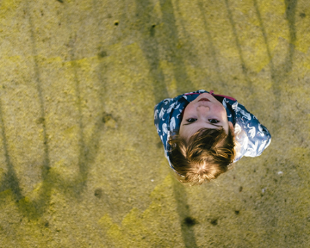 Photo of a child looking up