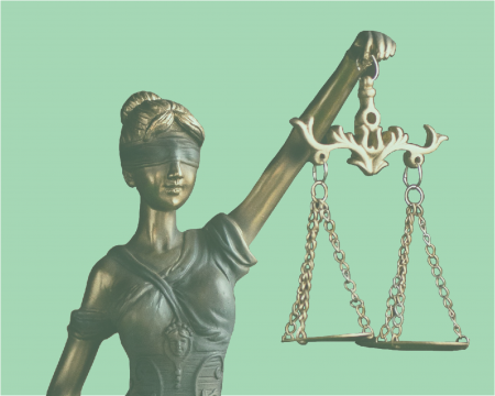 A statue of justice as a woman holding scales