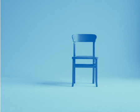 A photo of an empty chair.