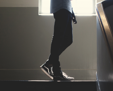 Photo of a student standing on a staircase