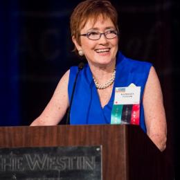 Photo of Executive Director Kathleen Taylor at the podium