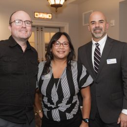 Three ACLU-WA staff and supporters smiling for the camera