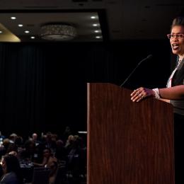 Photo of ACLU of Washington Deputy Director Michele Storms at the podium