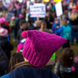Marchers in pink protest hats