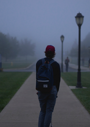 Photo of a student walking linking to our guide to defending youth in truancy proceedings